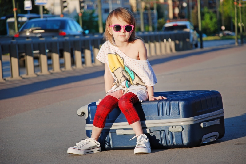 children photographer, black, childhood, dreams, 4K, luggage, day, front view, fashion, childrens beauty, sitting, the little girl, looking at camera