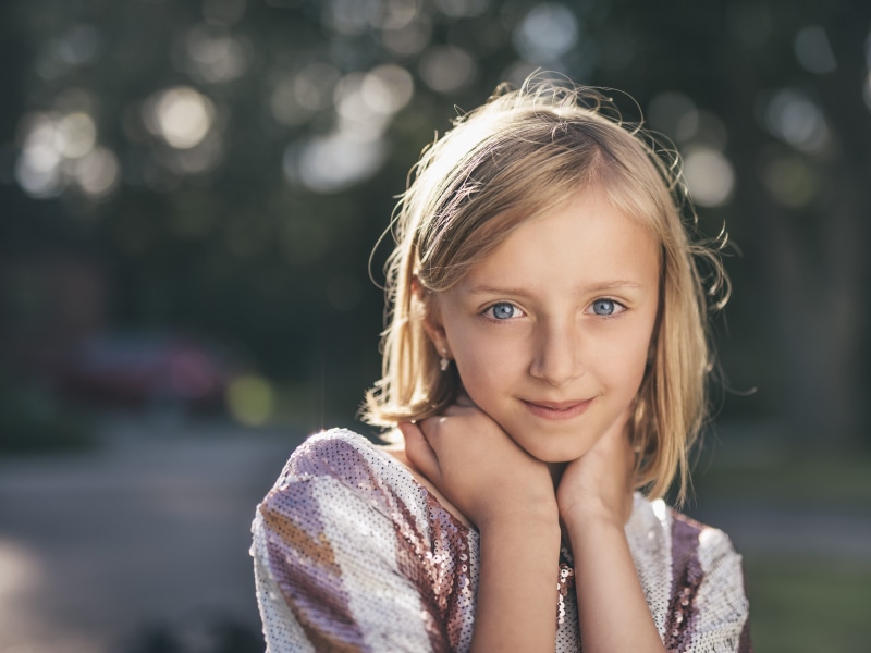 real people, headshot, focus, purple, facial Expression, happiness, elementary Age, childhood, hair, contemplation, hairstyle, outdoors, color Image, head And Shoulders