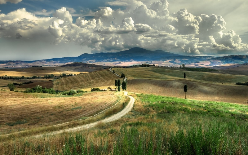 sky, field, landscape, scenics - nature, tranquil scene, tranquility, grass, non-urban scene, mountain, real people, outdoors, Tuscany, Italy, clouds, nature