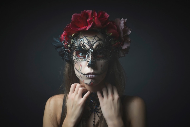 front view, face, headshot, face paint, beauty in nature, make-up, disguise, rose - flower, one person, black background, lifestyles, beautiful woman, skull