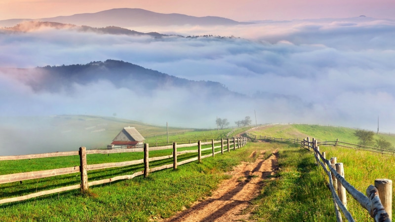 mountain, environment, village, fog, nature, plant, scenics - nature, agriculture, hill, fence, rural area, pasture, beauty in nature, farm, field, outdoors