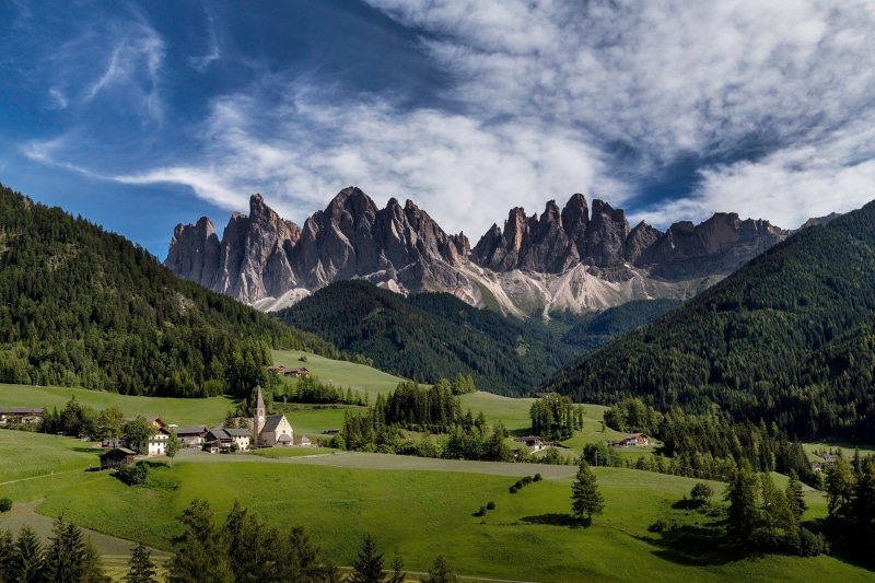 green color, tree, Val di Funes, environment, landscape, cloud - sky, meadows, mountain range, clouds, activity, mountain, no people, mountains, land, beauty in nature