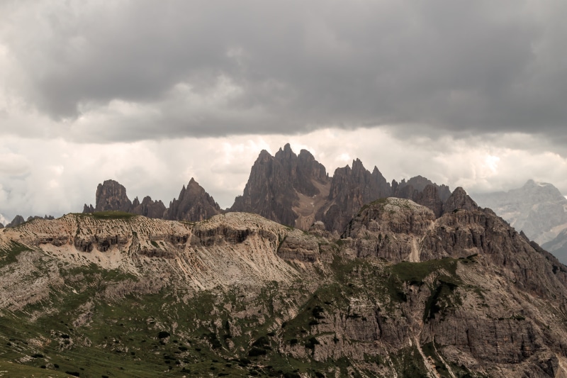 mountain peak, environment, scenery, tre cime di lavaredo, cloud - sky, crest, plateau, outdoors, grey, sky, mountain range, beauty in nature, eroded, landscape