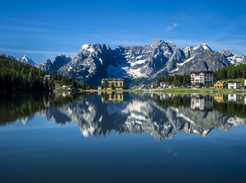 hotel, nature, mountain, waterfront, yellow, reflection, symmetry, formation, tranquility, lake, built structure, concrete, mountain range, dolmite, tranquil scene