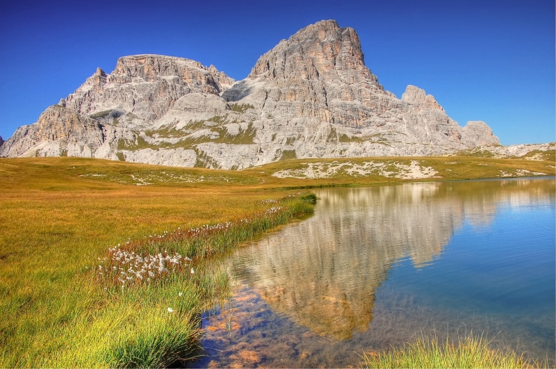 tranquil scene, lake, outdoors, formation, mountain, bergsee, sun, mountains, panorama, no people, nature, sky, travel, italy, idyll, land, reflection