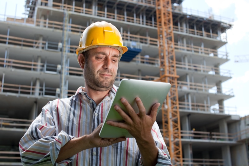 dress, front view, 5K, adult, red, construction Site, tablet, blue, business, working, internet, males, built Structure, focus on foreground, pinstripe