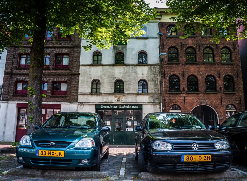 taxi, vehicle, automobile, sedan, van, nature, coupe, incidental people, arch, car, motor, building, cab, suv, netherlands, city, street, mode of transportation