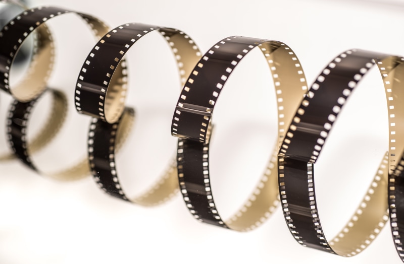 film industry, negative, obsolete, helix, filmstrip, brown, technology, tape, film reel, film, jewelry, no people, spool, entertainment, movie, industry