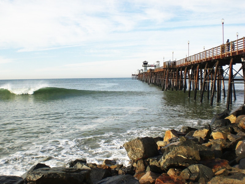 cloud - sky, pier, beauty in nature, oceanside, rock, scenics - nature, architecture, outdoors, ocean, solid, beach, motion, sky, nature, no people, sea