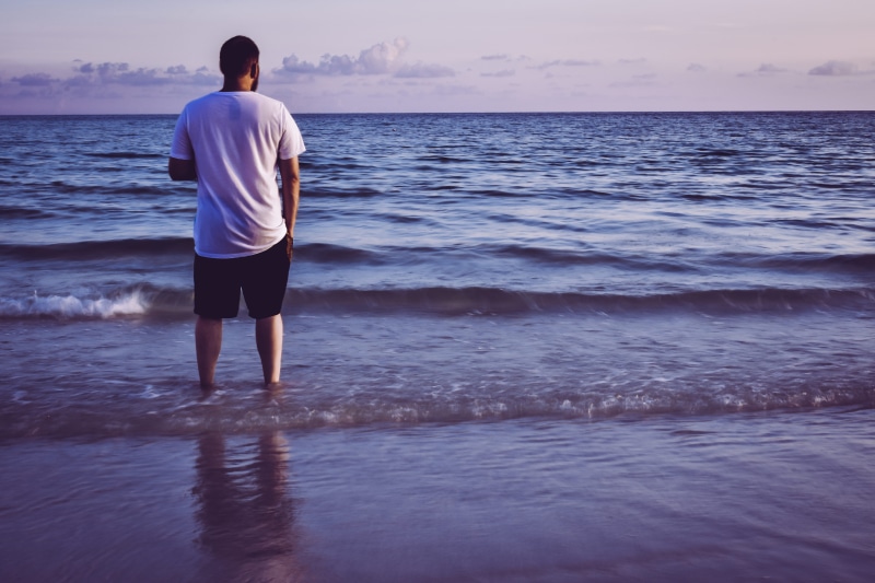scenery, shorts, sky, water, real people, scenic, outdoors, man, scenics - nature, shore, back, sand, guy, male, land, ocean, back view, environment, idyllic