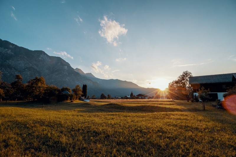 land, austria, environment, horizon, dirt road, sunbeam, travel, mountain line, tranquil scene, eurpoe, beauty in nature, tranquility, hillside, grass