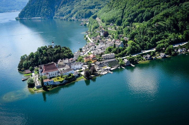 lake, tranquil scene, outdoors, tree, nature, water, austria, waterfront, mountains, landscape, beauty in nature, day, tranquility, built structure, high angle view