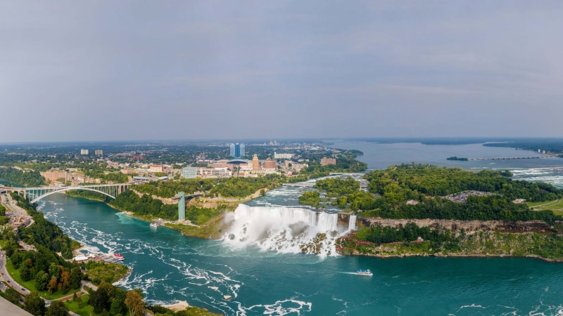 no people, beauty in nature, us, built structure, land, water, travel destinations, canada, cloud - sky, cityscape, falls, river, building exterior