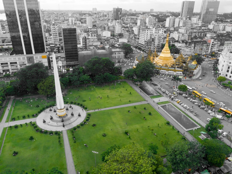 cityscape, plant, landmark, building exterior, monument, day, myanmar (burma), financial district, skyscraper, independence monument, nature, downtown