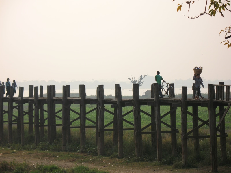 standing, clear sky, lifestyles, two people, barrier, mandalay, 2K, u leg bridge, nature, outdoors, day, people, fence, land, full length, men, sky, boundary