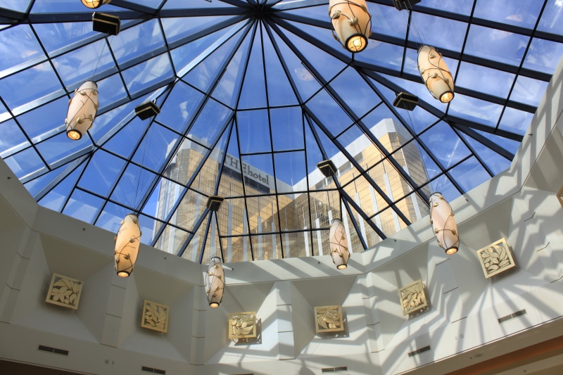 building exterior, strip, ceiling, casino, hotel, nature, hanging, glass - material, built structure, skylight, architecture, black, resort, sunlight, outdoors