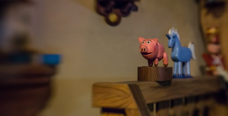 wood - material, toy, craft, ceramics, animal, animal themes, selective focus, representation, indoors, focus on foreground, business, pig, 5K, ride, seat
