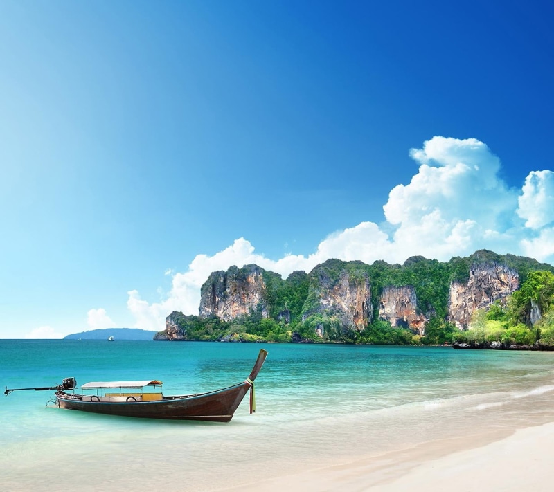 sky, longtail boat, turquoise colored, mode of transportation, outdoors, blue, water, beauty in nature, transportation, anchored, boat, tranquil scene