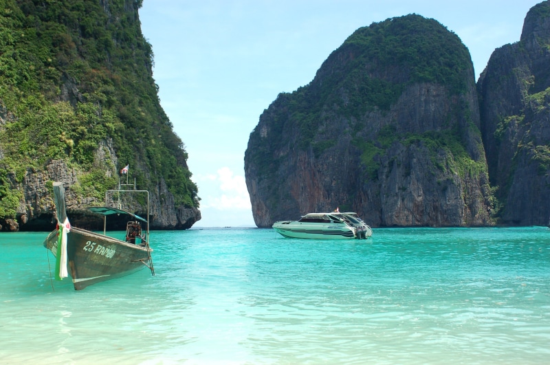 scenics - nature, mountain, seascape, bay Of Water, rock - object, mode of transportation, scenics, longtail, blue, vacations, longtail Boat, no people