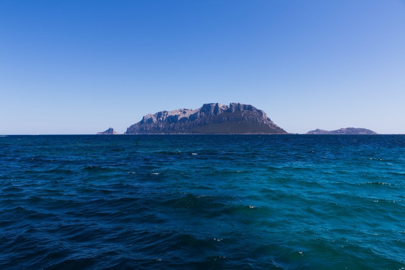 italy, solid, tavolara, no people, rock, sardinia, rock - object, blue, rock formation, beauty in nature, island, sardegna, copy space, stack rock, mountain