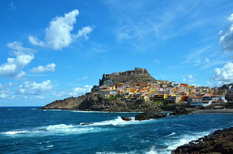land, water, old town, sky, nature, travel destinations, outdoors, horizon over water, cloud - sky, sardinia, blue, built structure, castelsardo, beauty in nature