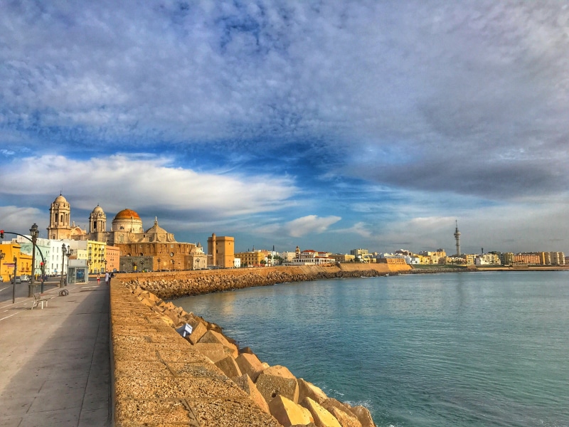 andalucia, building, outdoors, cadiz, river, history, waterfront, architecture, city, transportation, day, cityscape, ocean, travel destinations, travel