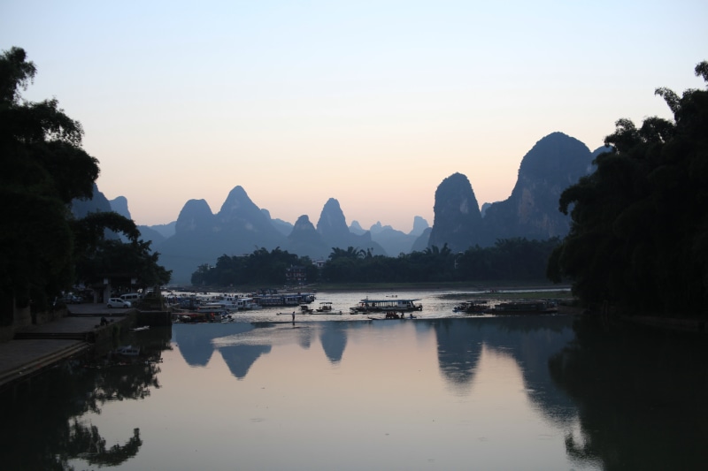water, tree, plant, the li river, outdoors, xingping, mountain, no people, sunset, river, transportation, waterfront, beauty in nature, tranquility, scenics - nature