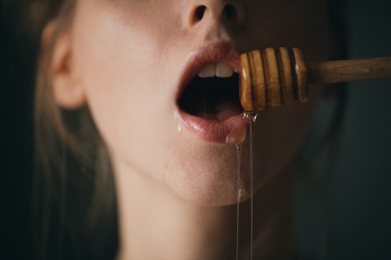 portrait, food, 1080P, adult, model, human face, close-up, brunette, honey, music, human lips, human mouth, honey dipper, headshot, focus on foreground
