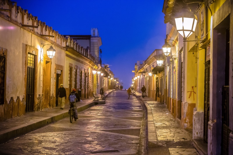 people, night, architecture, illuminated, urban, mexico, nature, somebody, adult, road, travel, buildings, building, built structure, direction, chiapas