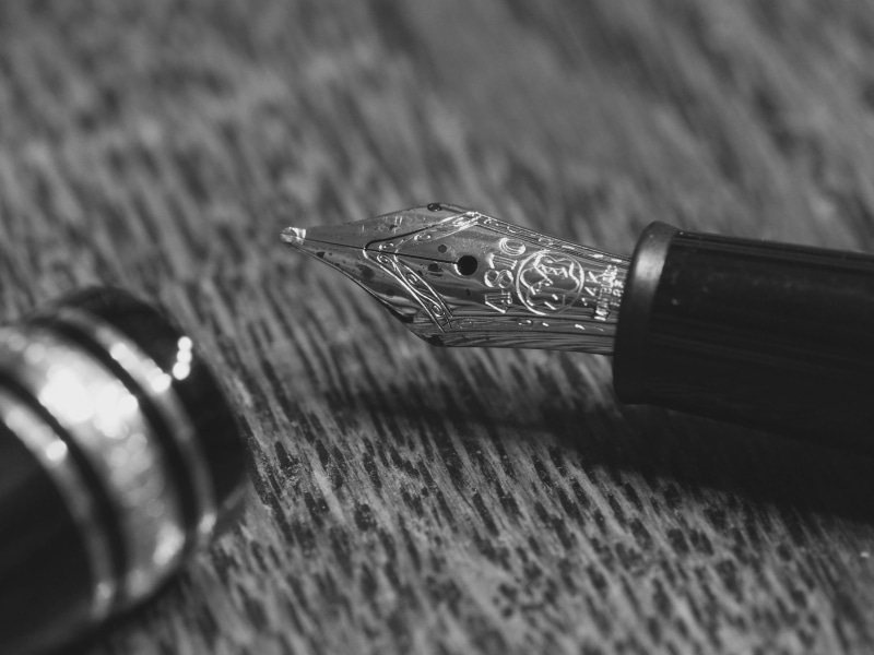 blur, business, selective focus, composition, table, indoors, close -up, still life, communication, metal, shadow, writing, wood - material, luxury, text