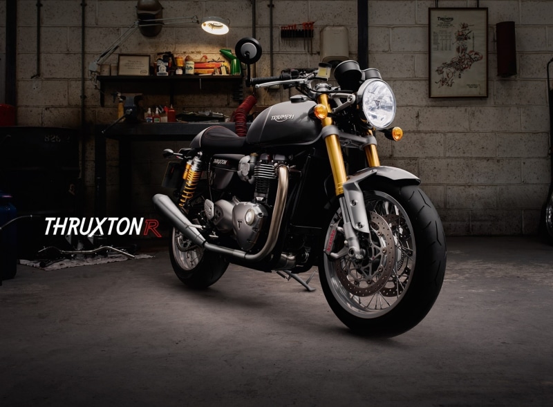 communication, garage, black, thruxton r, stationary, land vehicle, Triumph, cruiser, sign, mode of transportation, city, architecture, outdoors, building exterior
