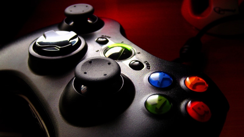 silver colored, selective focus, still life, xbox, music, studio shot, Game console, equipment, technology, multi colored, close-up, black Color, indoors