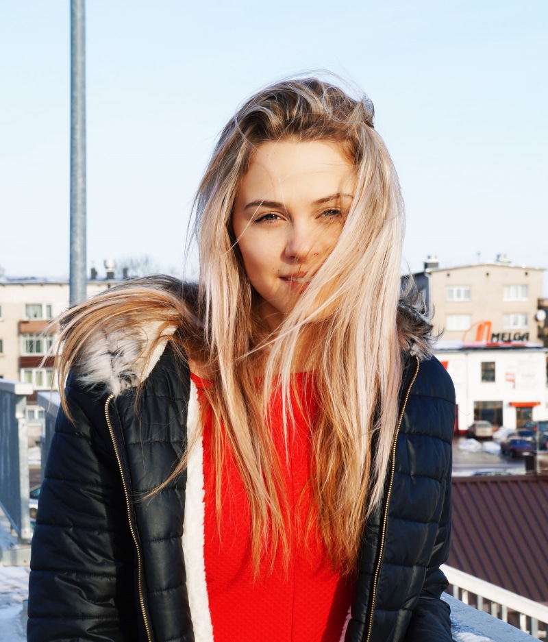 one person, outdoors, leather jacket, 1080P, hairstyle, smiling, casual, hair, stylish, posing, adult, waist up, female, attractive, leisure, lady, young women