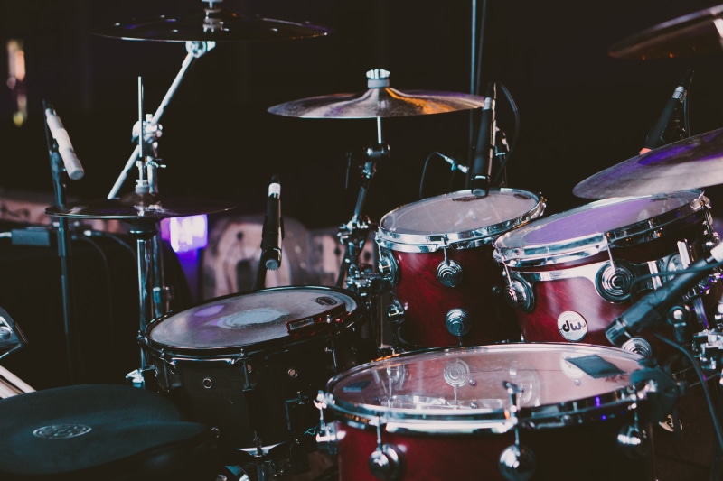 drum kit, drum - percussion instrument, percussion instrument, musical instrument, indoors, event, modern rock, artist, occupation, red, musical equipment