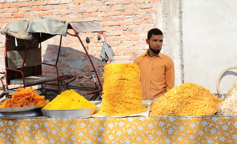traditional, selling, vendor, rural market, shop, waist up, casual clothing, retail, architecture, men, front view, store, one person, adult, indian, business