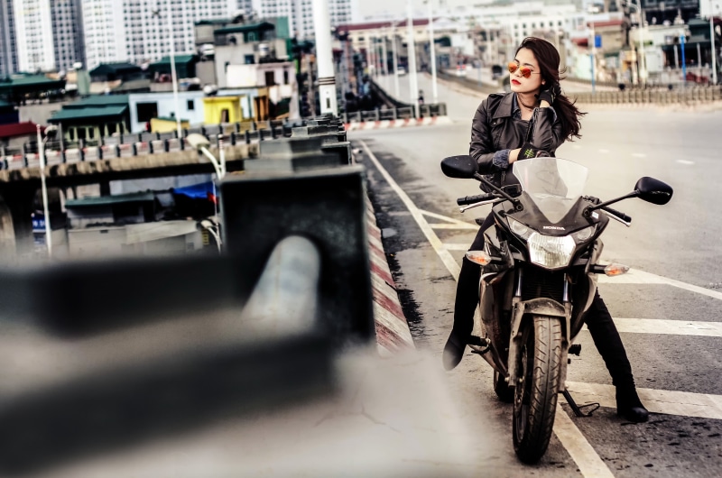 land vehicle, bicycle, leather jackets, one person, women, jacket, city, motorcycle, leather jacket, transportation, outdoors, adult, model, leather, Asian