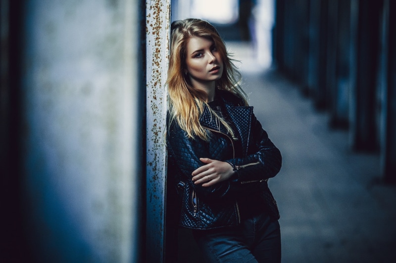 leather, three quarter length, women, adult, one person, hairstyle, leather jacket, clothing, contemplation, black jackets, jacket, real people, beautiful woman