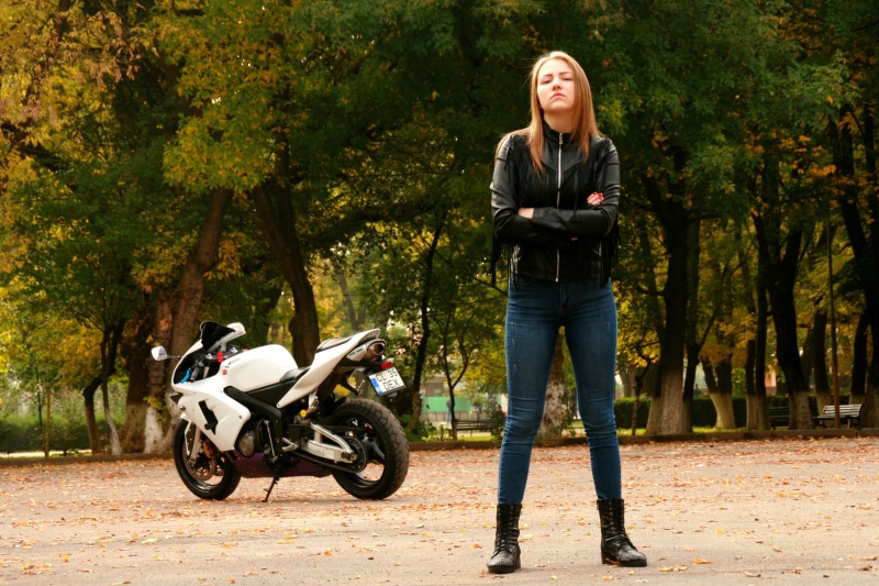 jeans, biker, adult, standing, transportation, women, motorcycle, mode of transportation, hairstyle, outdoors, lifestyles, 4K, leather, young women, casual clothing
