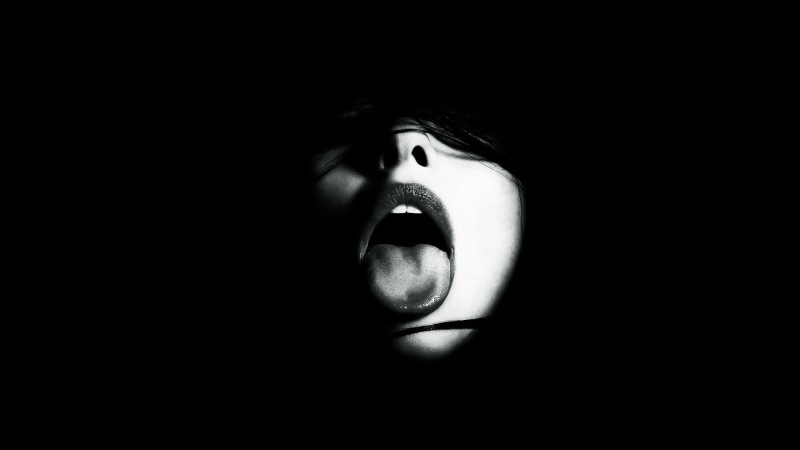 innuendo, domestic room, black background, portrait, face, headshot, real people, dark, child, human face, darkroom, monochrome, mouth open, human hair