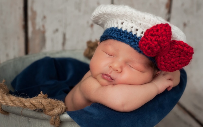 real people, one person, babyhood, hat, innocence, sailor, close-up, child, warm clothing, cute, white, indoors, young, Baby, clothing, girl, s, day, blue
