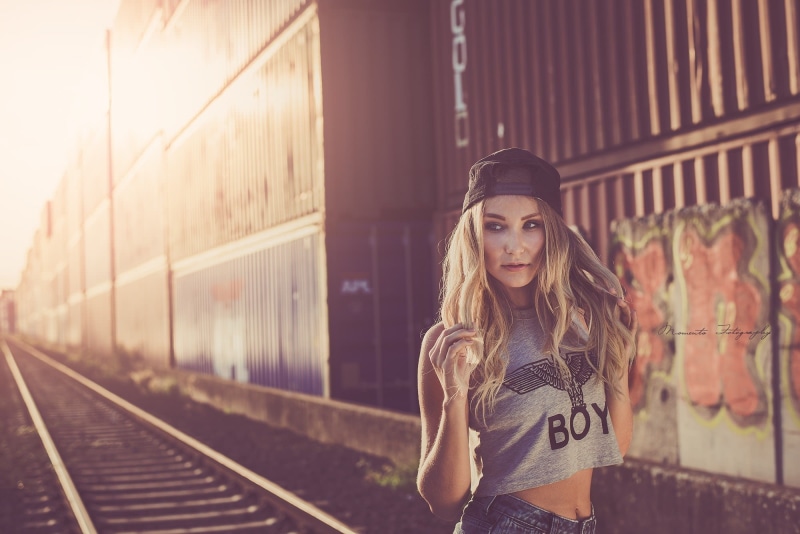 grey tops, women, beautiful woman, one person, railroad track, lifestyles, portrait, adult, waiting, rail transportation, holding hair, beauty, train - vehicle