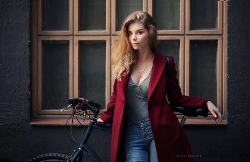 women outdoors, jeans, bicycle, necklace, model, coats, women, open jacket, portrait, blonde, looking at viewer, grey tops, standing, Irina Popova, Sean Archer