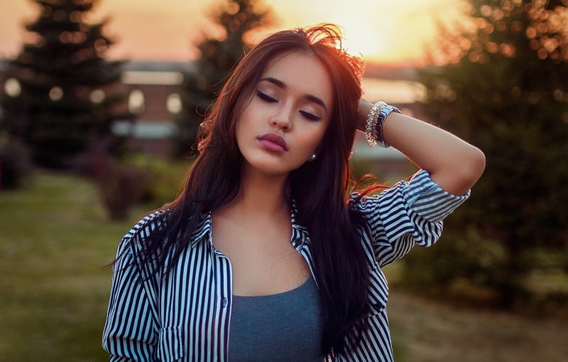 juicy lips, depth of field, closed eyes, 1080P, grey tops, hands on head, sunset, portrait, shirt, women