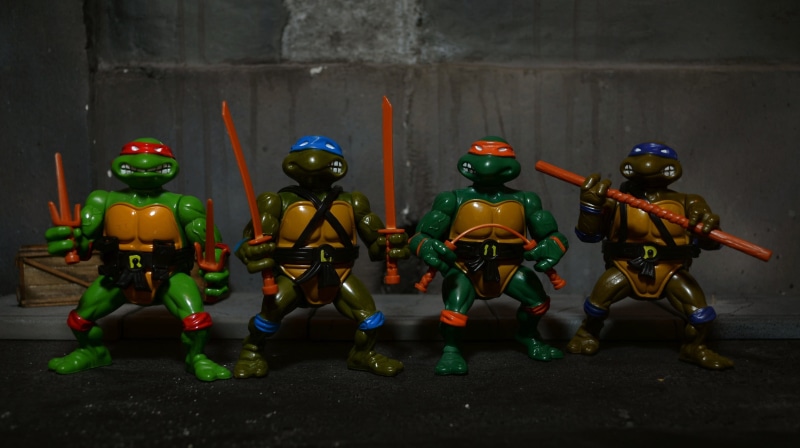 table, action figures, multi colored, art and craft, tmnt, Teenage Mutant Ninja Turtles, 2K, toy, side by side, military, male likeness, action, armed forces