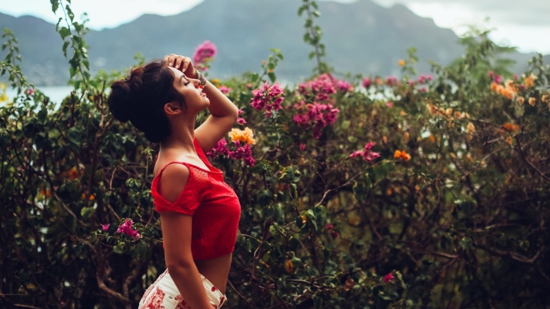 lifestyles, beautiful woman, flower, nature, flowering plant, outdoors, day, real people, young women, vulnerability, hairstyle, one person, beauty in nature