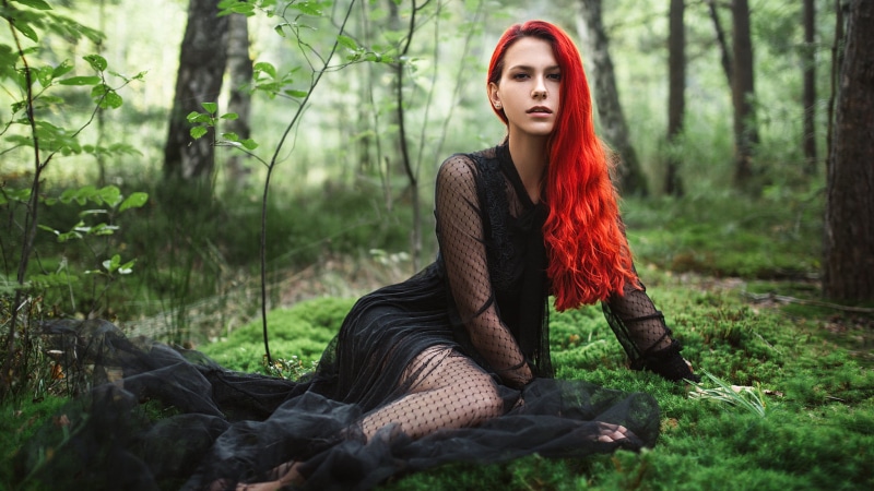 grass, forest, nature, open mouth, long hair, looking at viewer, dyed hair, Igor Kondukov, black clothing, women, black dress, earring, wavy hair, jewelry