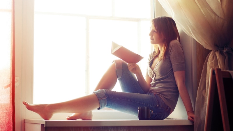 long hair, books, one person, casual clothing, young women, adult, redhead, jeans, beautiful woman, lifestyles, cardigan, feet, indoors, window, women