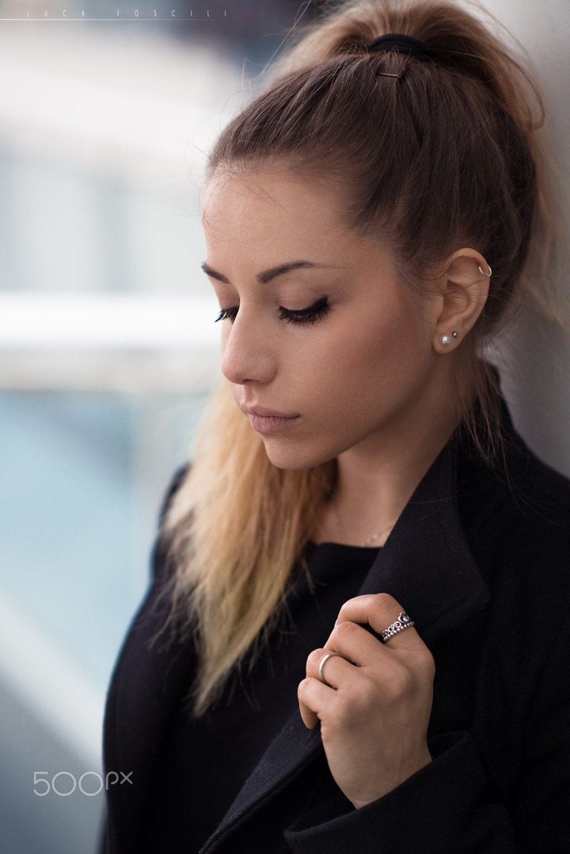 looking down, portrait, headshot, young women, human face, beauty, focus on foreground, 1080P, pearl earrings, long hair, black color, contemplation, black clothing
