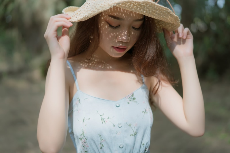 outdoors, lifestyles, day, model, portrait, beauty, pearl earrings, young women, women outdoors, Asian, beautiful woman, sun hat, adult, closed eyes, depth of field
