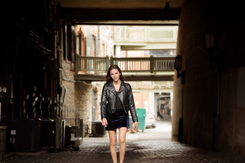 architecture, young women, girl, beautiful woman, leather jacket, wear, solo, front view, building, looking at camera, real people, leather, hairstyle